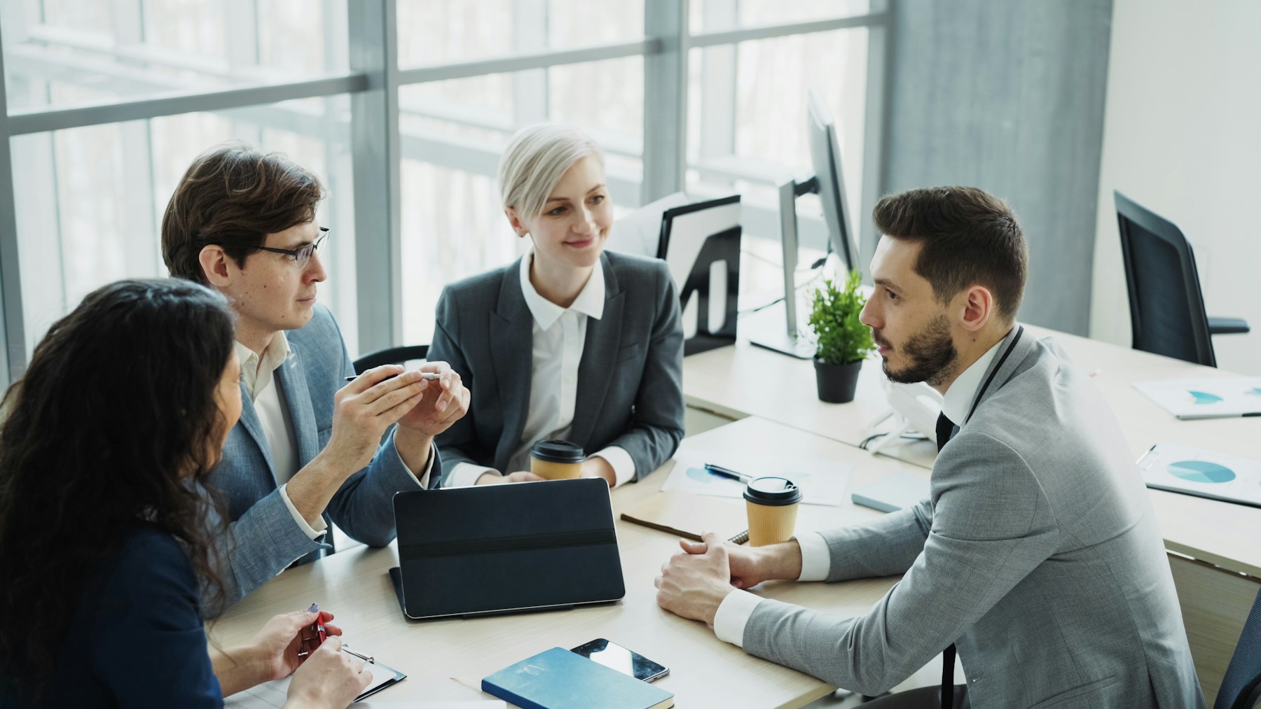 Business team collaborating around a meeting table